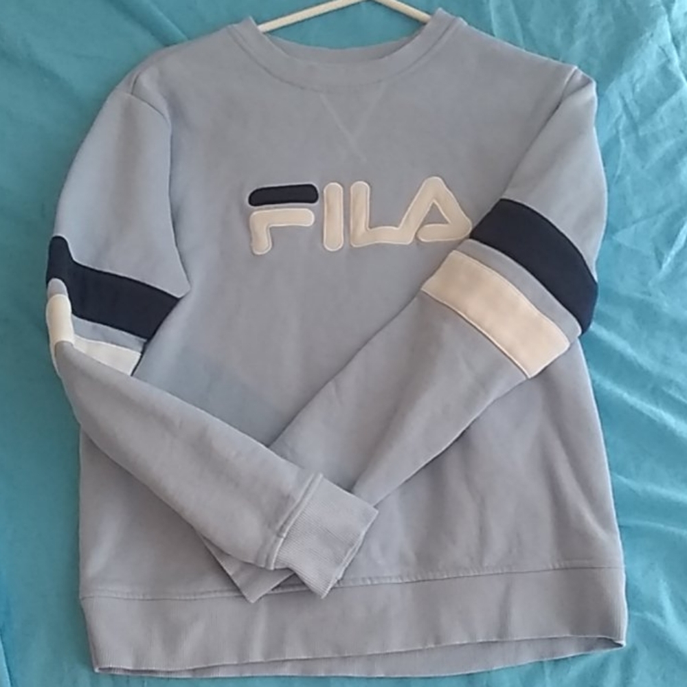 Long sleeve light baby blue shirt.